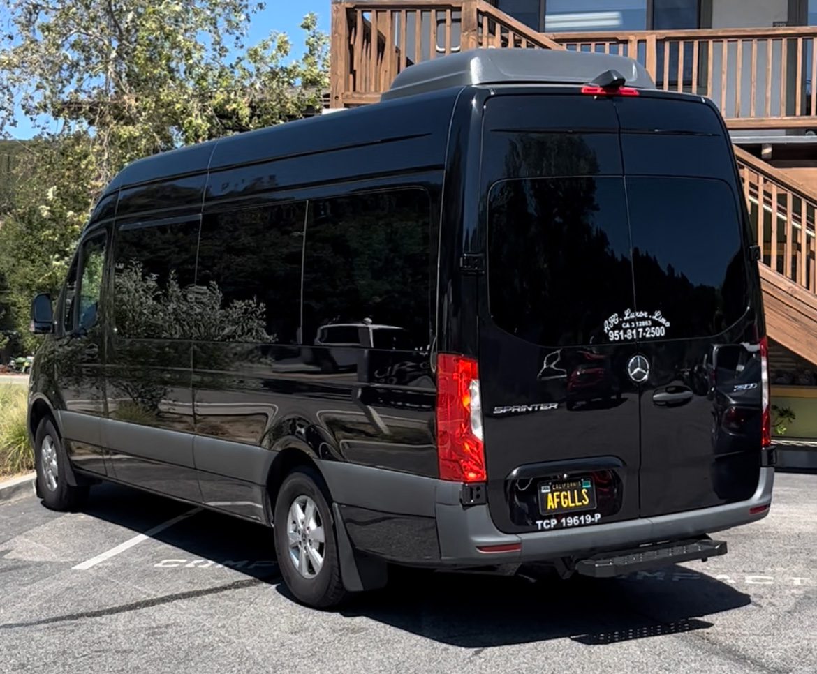 A black van parked in the parking lot